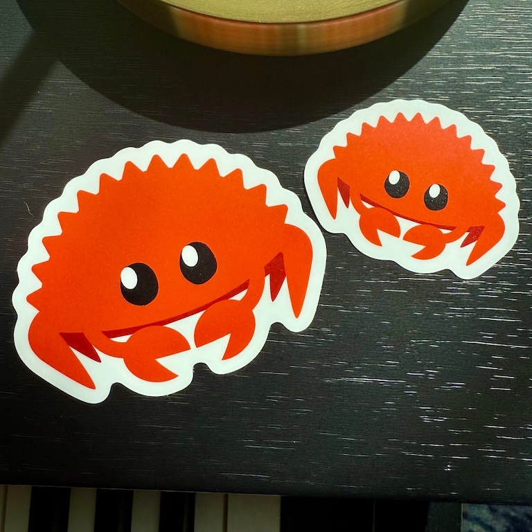 Ferris the Rustacean sticker on a laptop